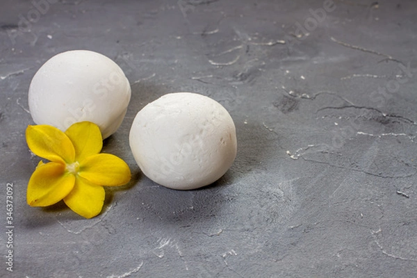 Fototapeta ice cream vanilla in a spoon and orchid flower
