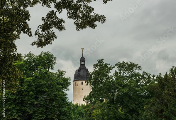 Obraz View of the tower of Altenburg castle against a cloudy sky. Germany. Soft focus, blurry background.