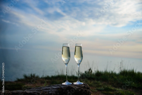 Obraz 
champagne glasses at sunset