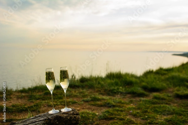 Obraz 
champagne glasses at sunset