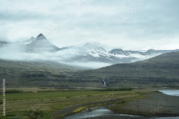 Obraz Waterfall under snowy mountains