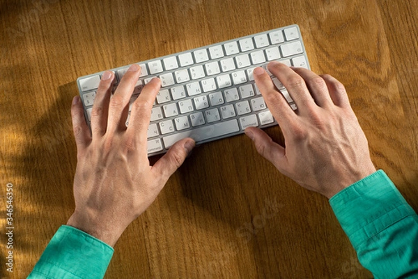 Obraz men's hands type on the keyboard