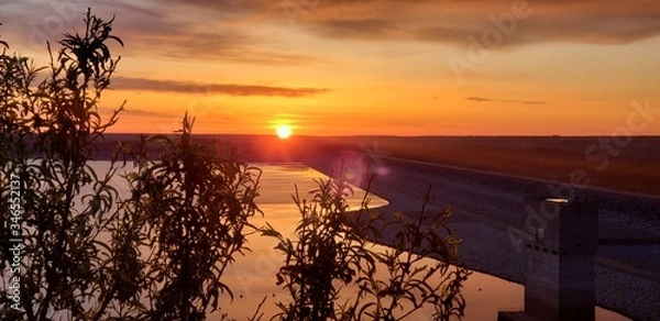 Fototapeta sunset over the river
