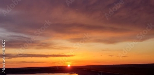 Fototapeta sunset over the river