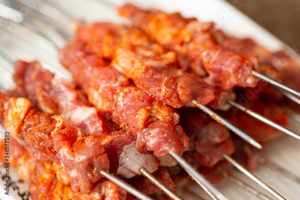 Fototapeta Spicy raw chicken BBQ skewers 