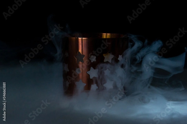 Obraz candlestick in smoke on a black background
