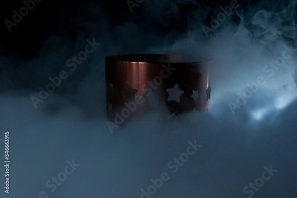 Obraz candlestick in smoke on a black background