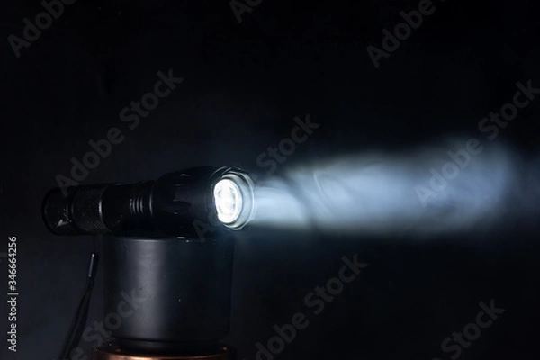Obraz LED flashlight beam in smoke
