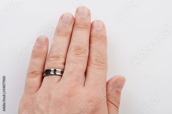 Fototapeta Black ring on man hand