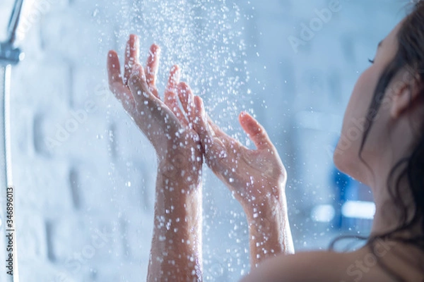 Fototapeta Woman's hand Shower