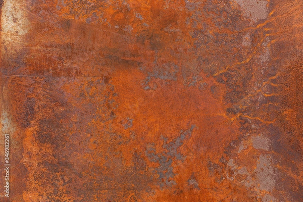 Fototapeta Orange red old rusty metal surface. An weathered oxidized patina with a copper color, texture and structure. Vintage material effect