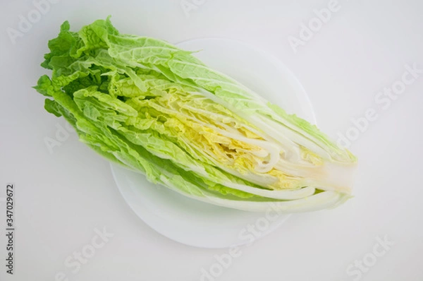 Obraz Chinese cabbage (in Japan called Hokusai) cut in poplam on a white isolated background close-up
