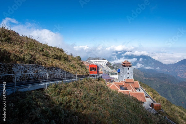 Fototapeta landscape view at Fansipan peak mountain, there are temple and buddha statue on the top famous place for travel in Sapa city, Vietnam.