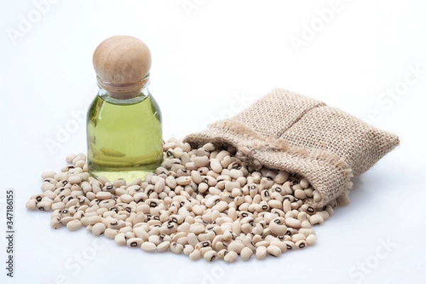 Fototapeta The oil is extracted from the white beans and the white beans seeds that have sacks on a white background