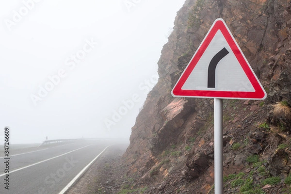 Obraz Sharp turn warning road sign