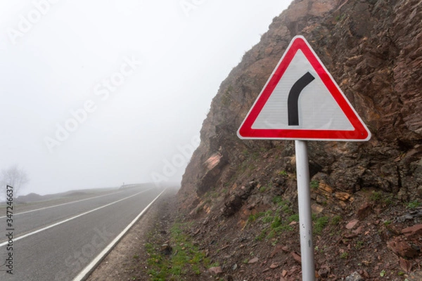 Obraz Sharp turn warning road sign