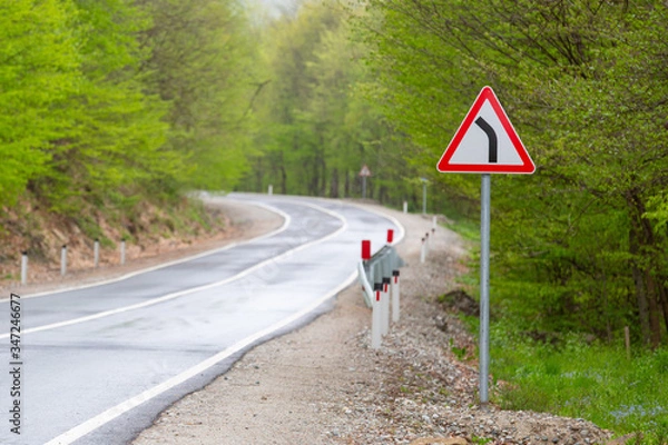 Obraz Sharp turn warning road sign