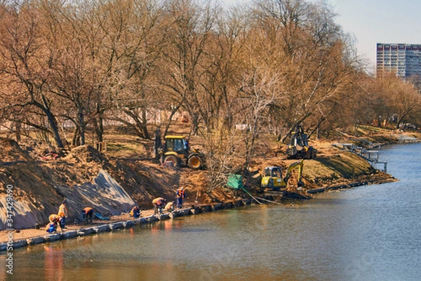 Fototapeta Water purification by workers and reconstruction of the coastal area with trees