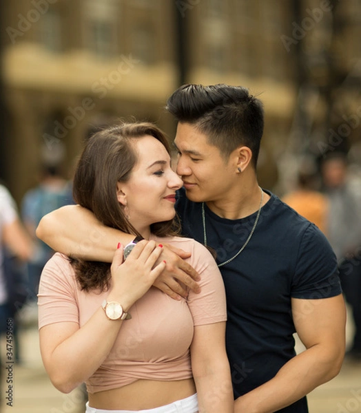 Fototapeta young couple enjoying a cuddle together