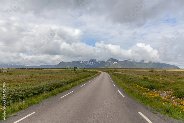 Obraz road passing in a valley between mountains in Norway, selective focus