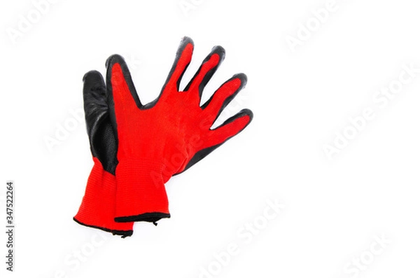 Fototapeta Gloves for workers, construction red with black rubber coating. Black-red gloves. Gloves on a white background, palm up, down. Glove on  glove