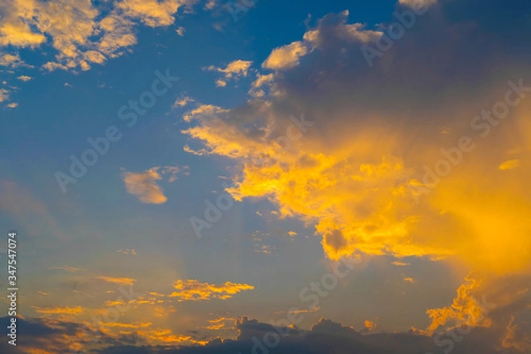 Obraz blue sky with golden orange cloud sunset