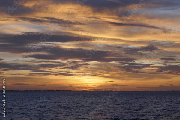 Obraz Cloudy Sunset at the ocean