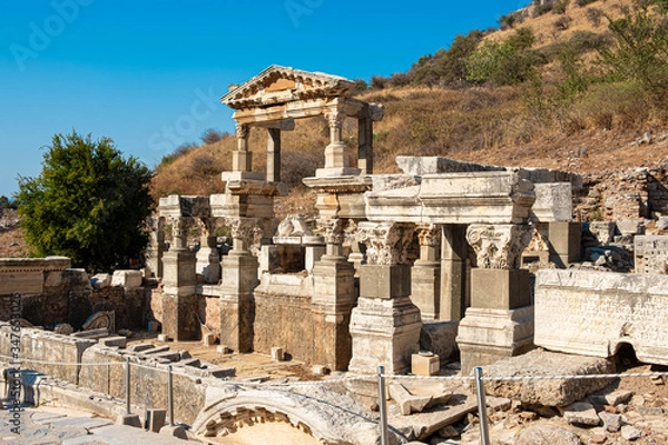 Fototapeta Kusadasi, Turkey - April 28, 2019: People visiting Celsus Library and old ruins of Ephesus or Efes famous site