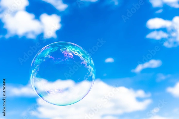 Obraz Blown bubble and blue cloudy sky
