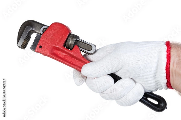 Fototapeta Pipe wrench in hand in protective glove on white background