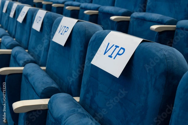 Fototapeta Row of empty chairs before business meeting.