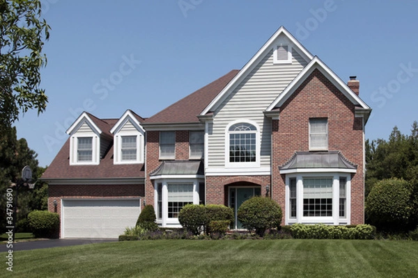 Obraz Brick home with arched entry