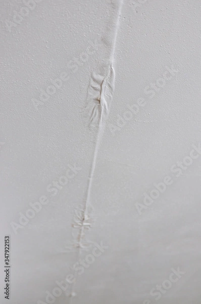 Obraz White textured wall paint with water damage