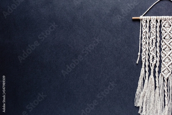 Fototapeta macrame on black background, place for text, banner, flat layout, handmade, hobby, creativity, copy space, top view