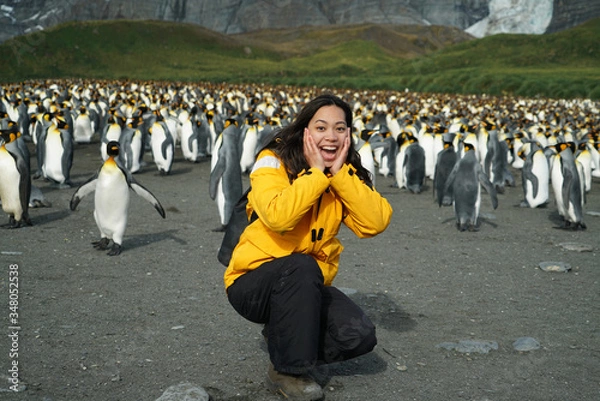 Fototapeta Woman Happy in front of Penguin Colony