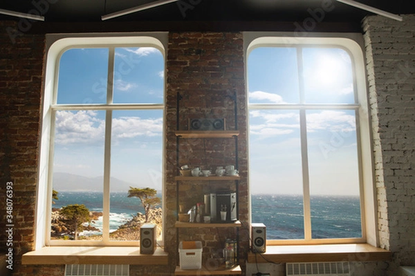 Fototapeta Closed window and beautiful picture outside, nature view, resort and resting. Sunny summers or spring day with green grass, sea or ocean, bright and vibrant colors. Tourism, hotels or home mood.