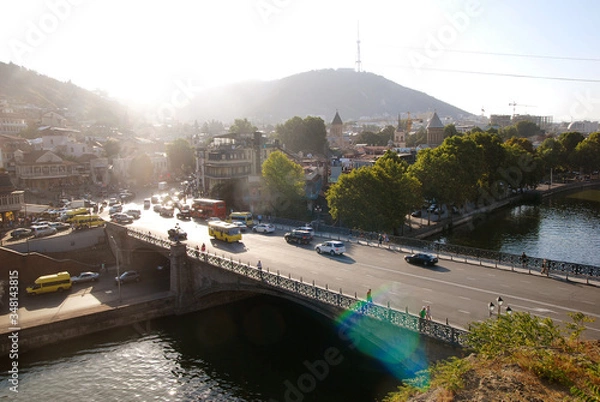 Fototapeta View of the Metekhi Bridge in Tbilisi at sunset