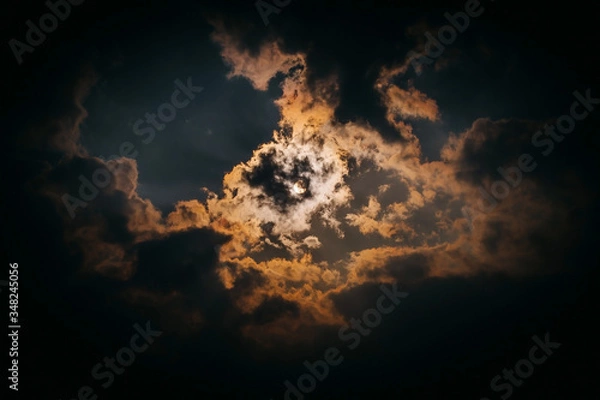 Obraz Dramatic sunset covered by clouds beautiful view.