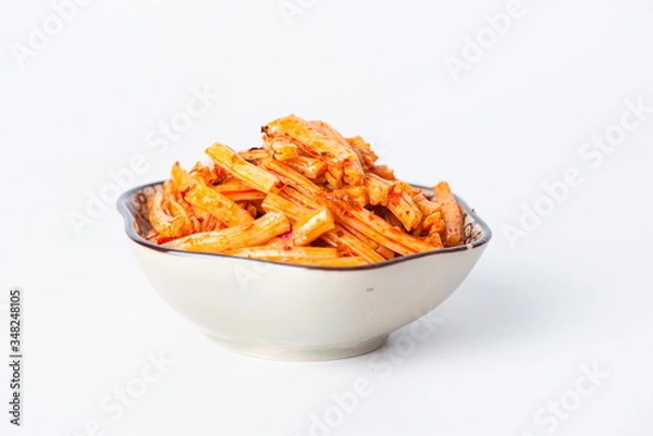 Fototapeta The tofu skin with the marinade was very chewy with the chili sauce, and he put it in a bowl against a white background