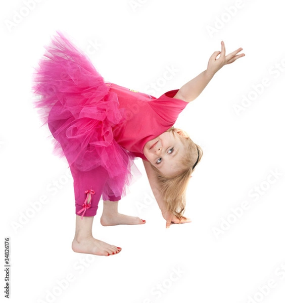 Obraz little girl in a pink dress dancing in the studio bow