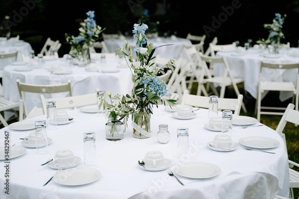 Fototapeta photo of an empty wedding dinner tables in the garden