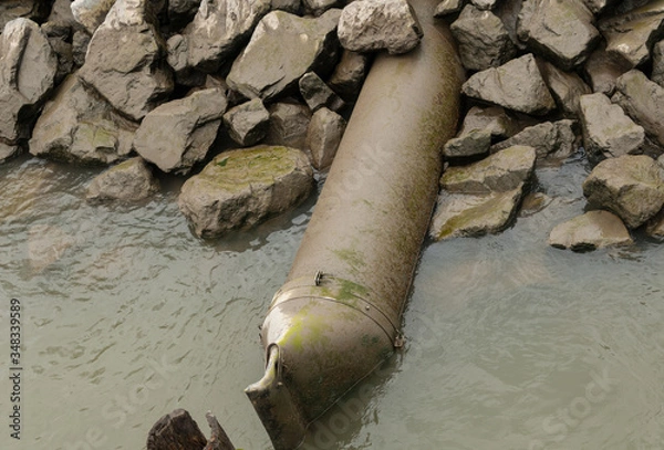 Obraz water pipe on the river