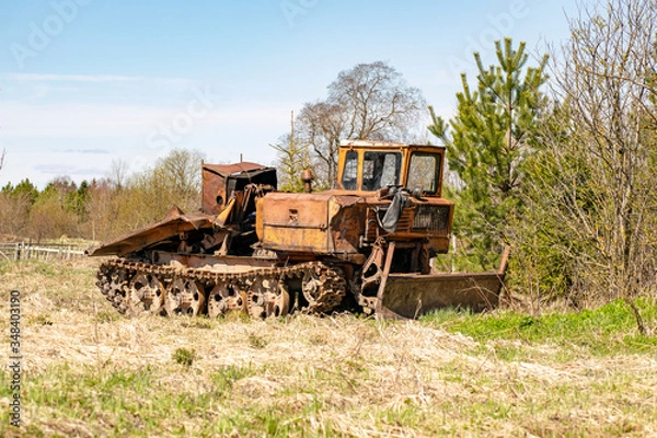 Fototapeta Skidder in the forest awaiting loading.