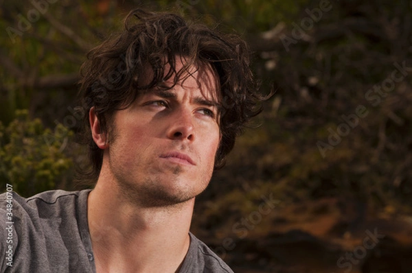 Fototapeta Young man deep in thought