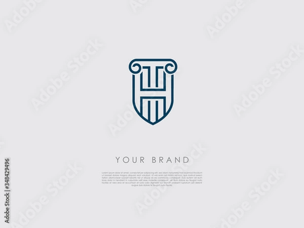 Fototapeta a blue business logo that looks like a shield and has representations of an ancient column, letter h and t 