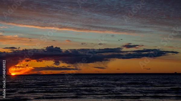 Obraz Sunset on the beach, dramatic sky, dramatic clouds.