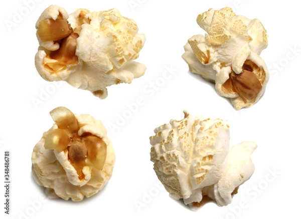Fototapeta Popcorn is made from corn kernels on a white background.