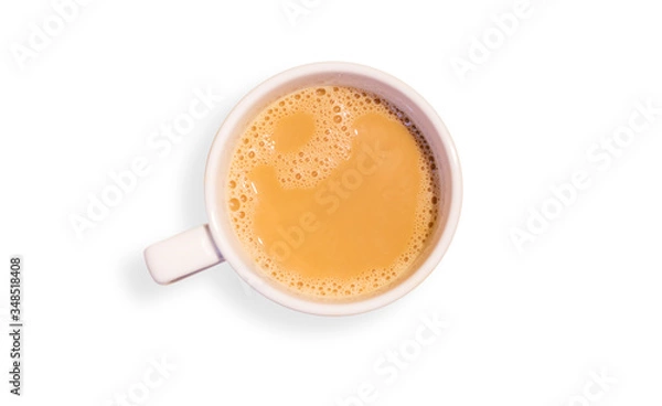 Fototapeta Coffee or tea with milk in white cup isolated over white background.View from top.