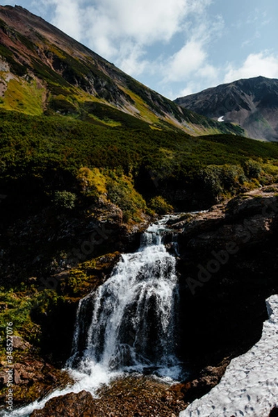 Fototapeta Waterfall in the mountain range. Kamchatka
