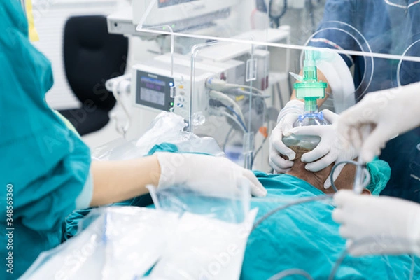 Obraz doctor pre oxygenation patient under plastic box